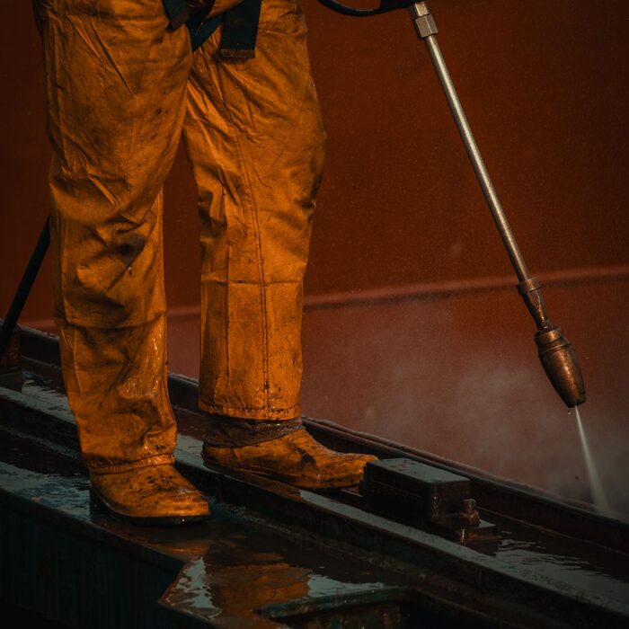 Pressure washing a driveway and home exterior